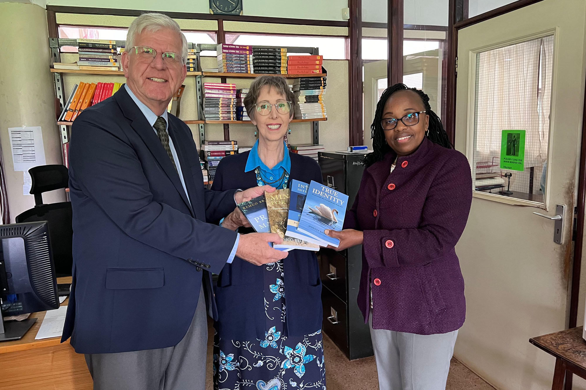 Remco & Jennifer donating copies of their books to the Africa International University library.