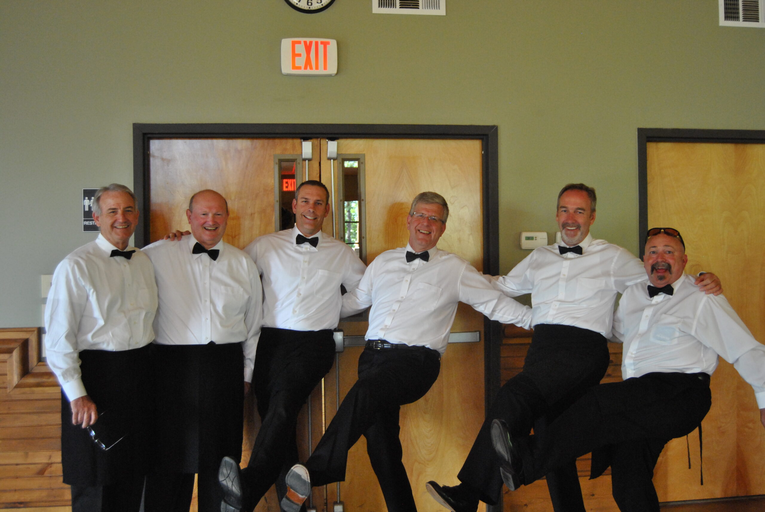 Men's retreat team serving at a special dinner.